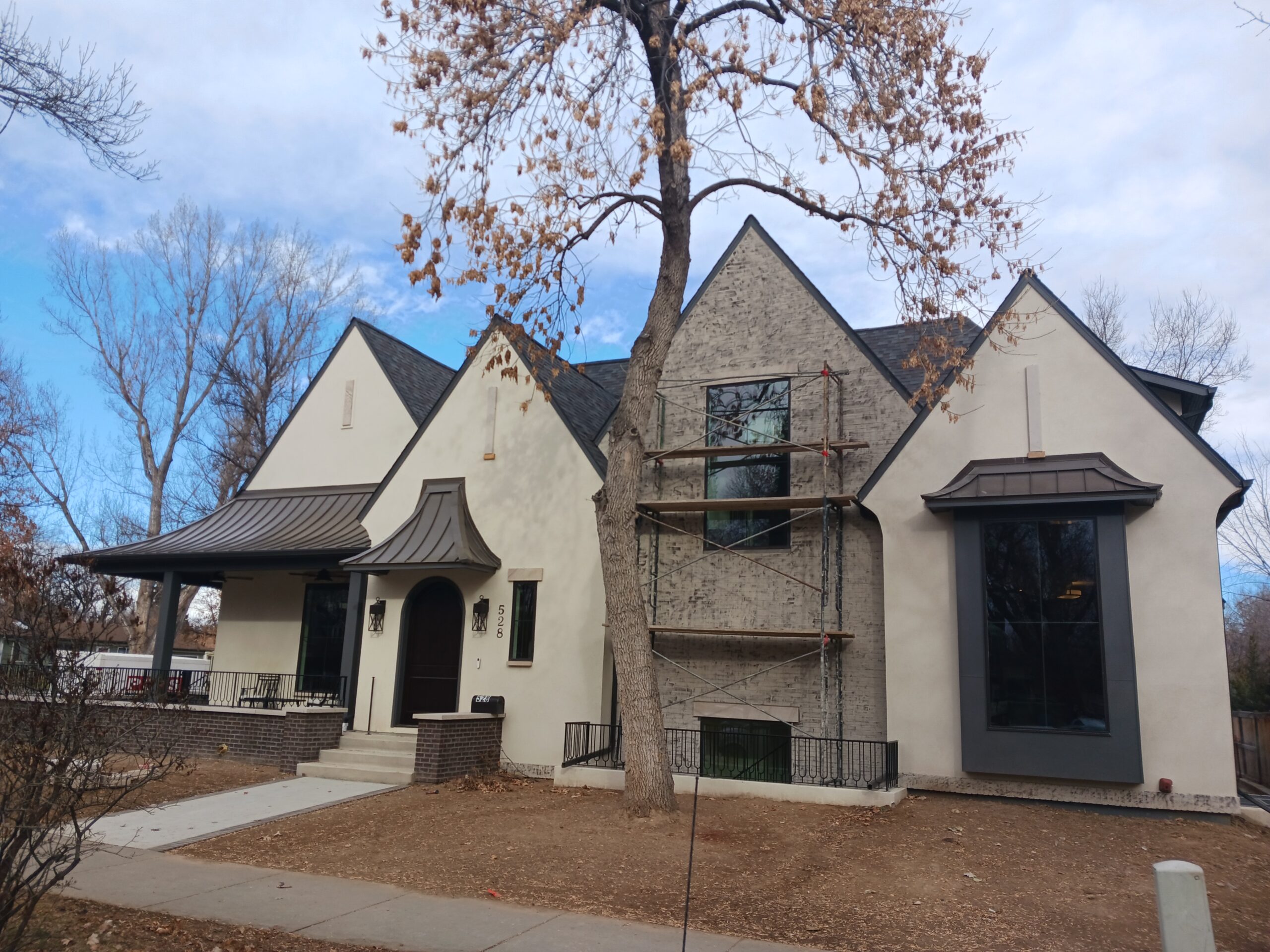IMage of a house being repainted for the blog Best Local Painters Northern Colorado